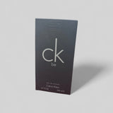 Calvin Klein CK Be perfume packaging on a gray background