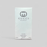 Gucci Guilty cologne packaging on a gray background