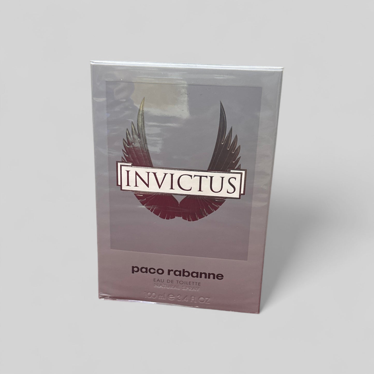 Paco Rabanne Invictus perfume packaging on a light gray background