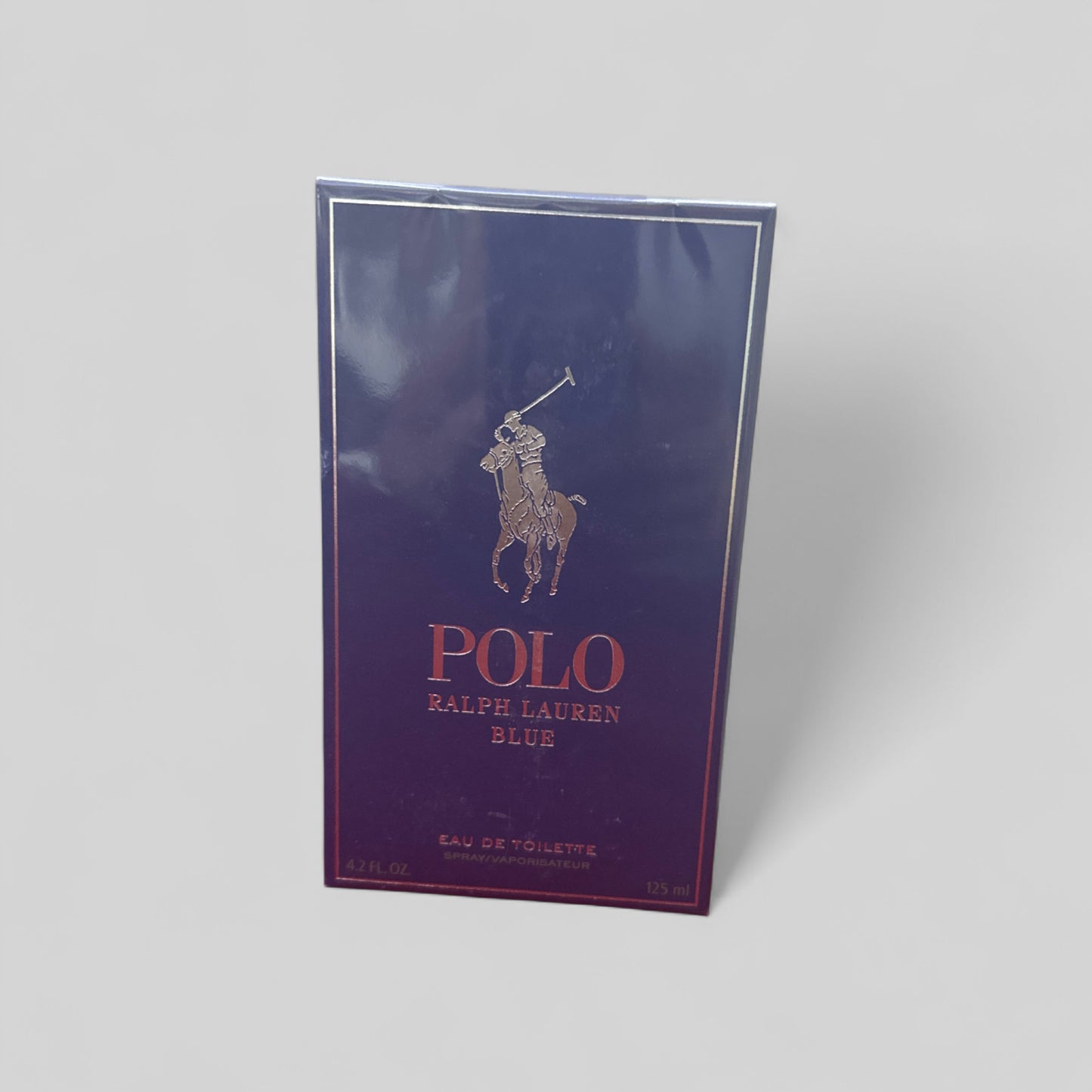Polo Ralph Lauren Blue Eau de Toilette packaging on a light gray background