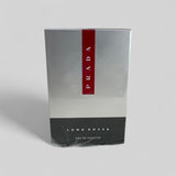 Prada Luna Rossa Eau de Toilette packaging on a light gray background