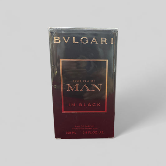 Bulgari Man in Black perfume packaging on a gray background
