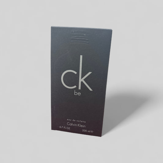 Calvin Klein CK Be perfume packaging on a gray background