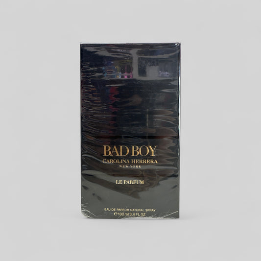 Carolina Herrera Bad Boy perfume packaging on a gray background