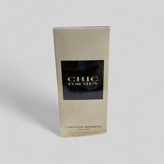 Carolina Herrera Chic for Men perfume packaging on a light gray background