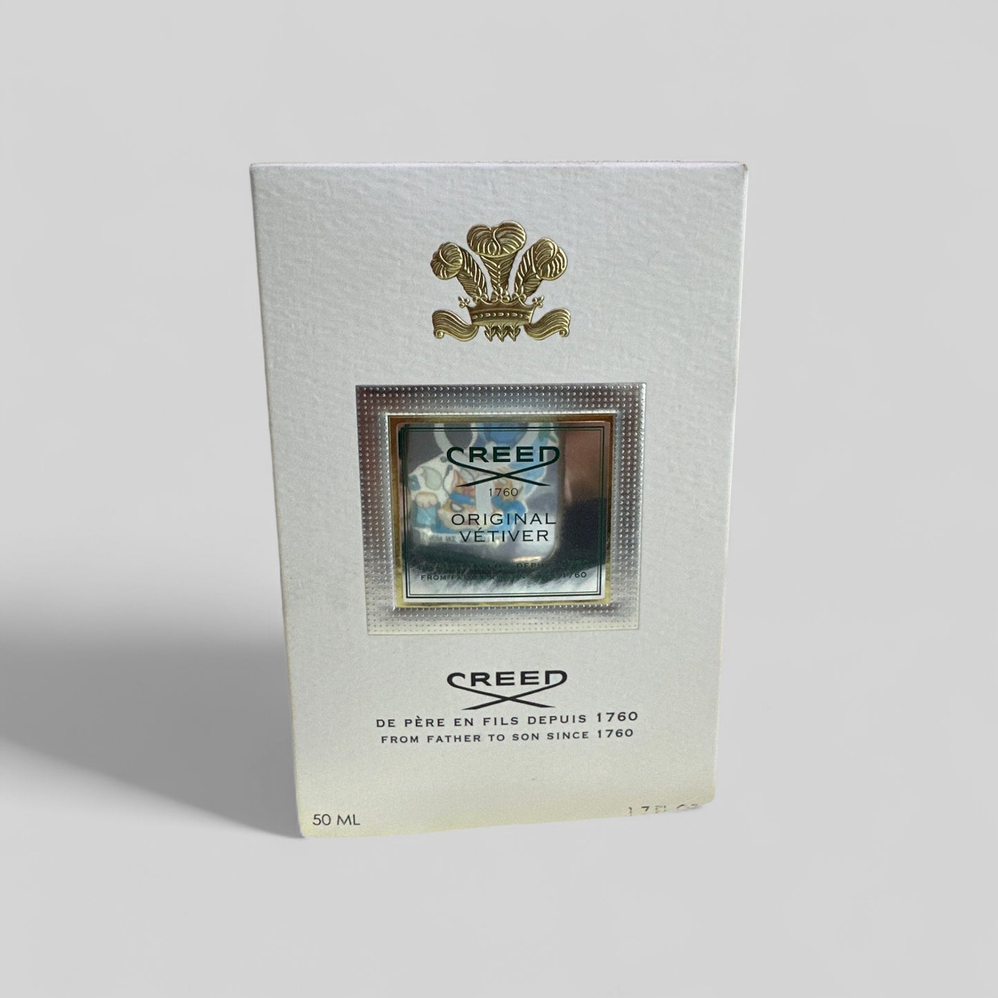Creed Original Vetiver perfume bottle packaging on a light gray background
