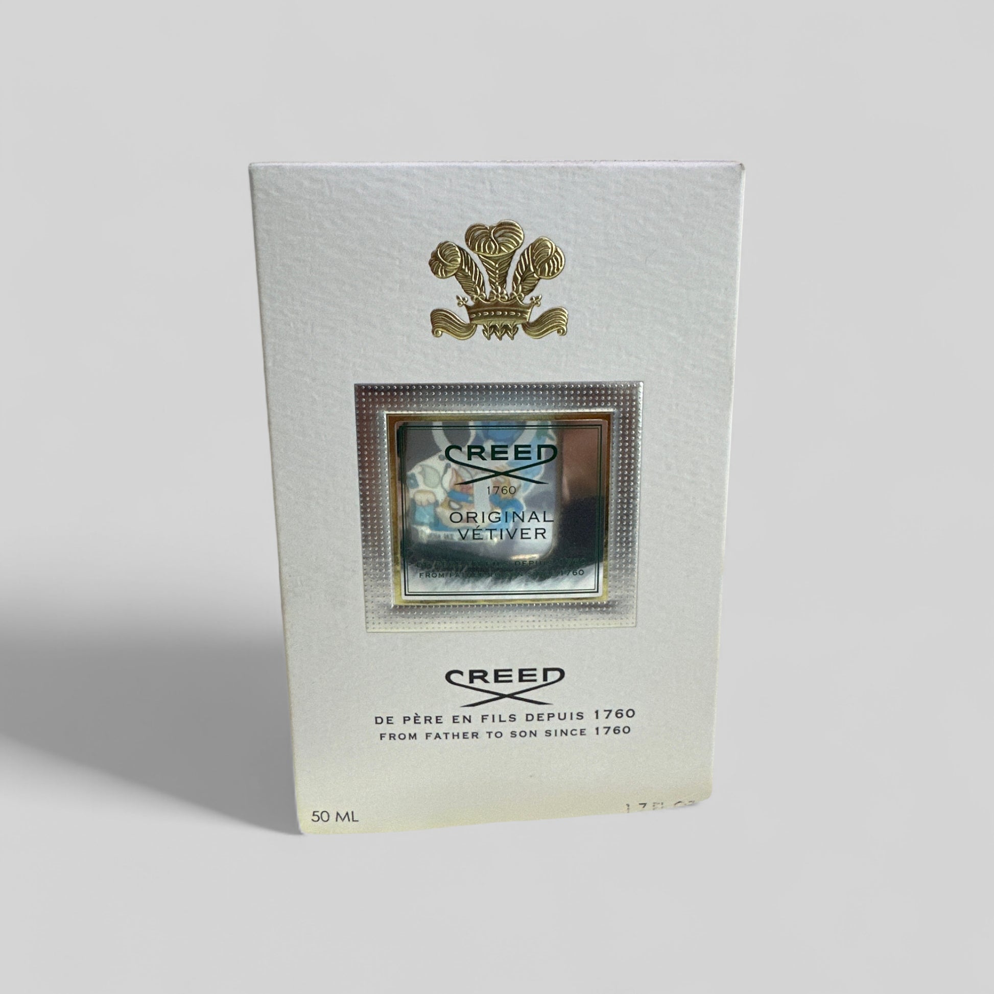 Creed Original Vetiver perfume bottle packaging on a light gray background