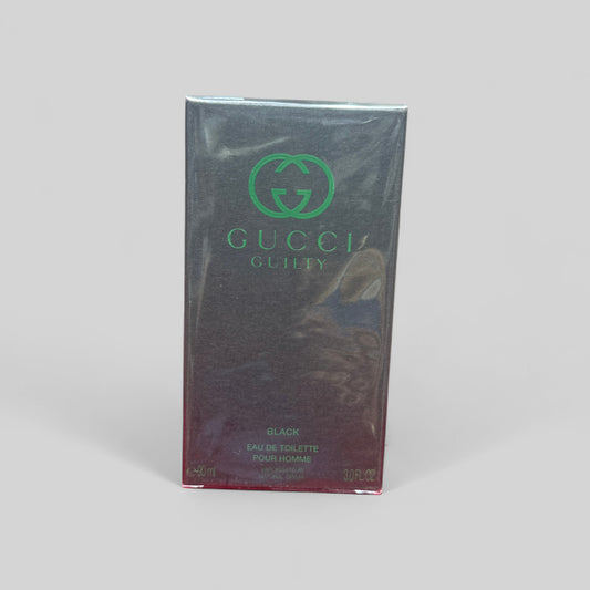 Gucci Guilty Black Eau de Toilette packaging on a gray background