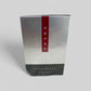 Prada Luna Rossa eau de toilette packaging on a gray background