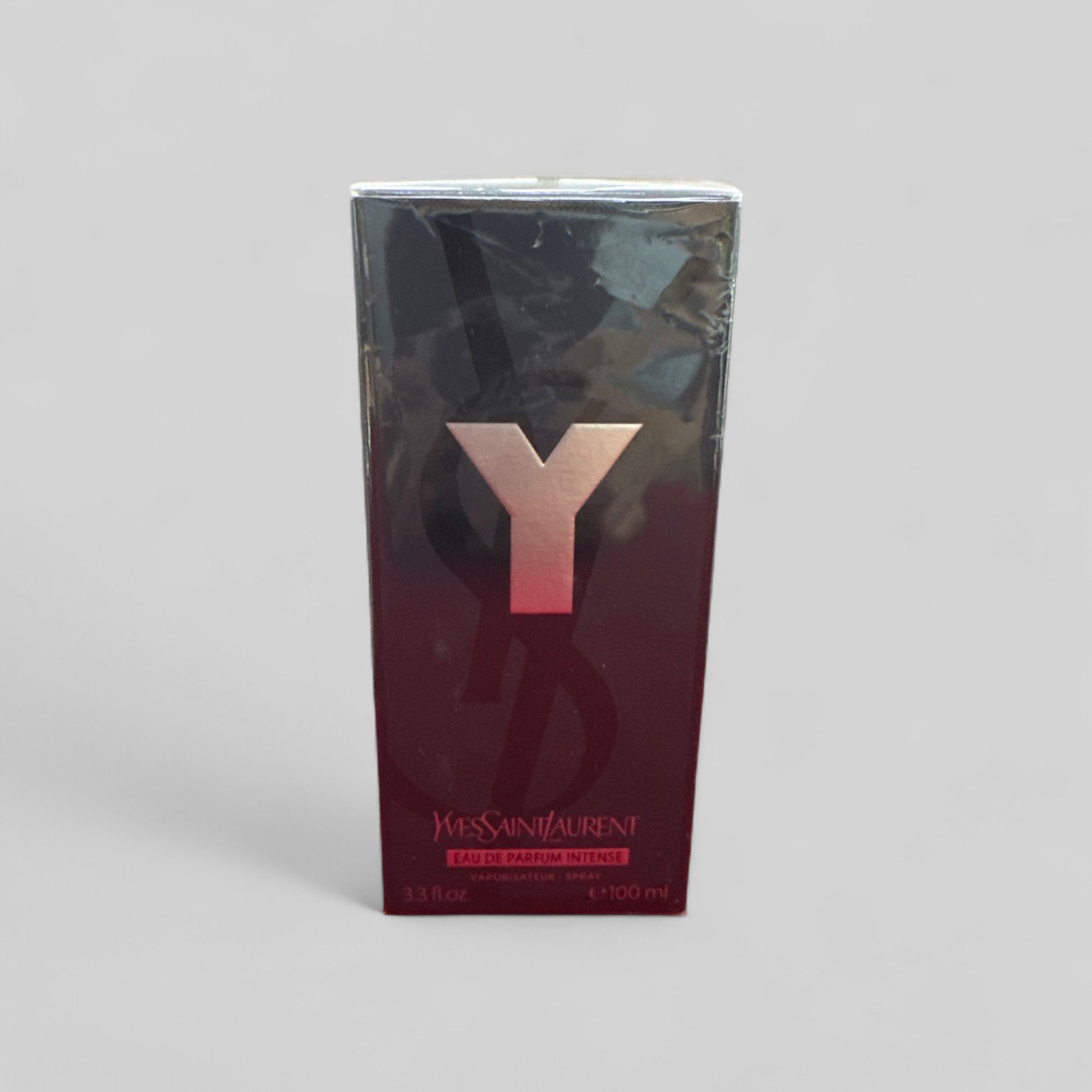 YSL perfume box with 'Y' logo on a gray background