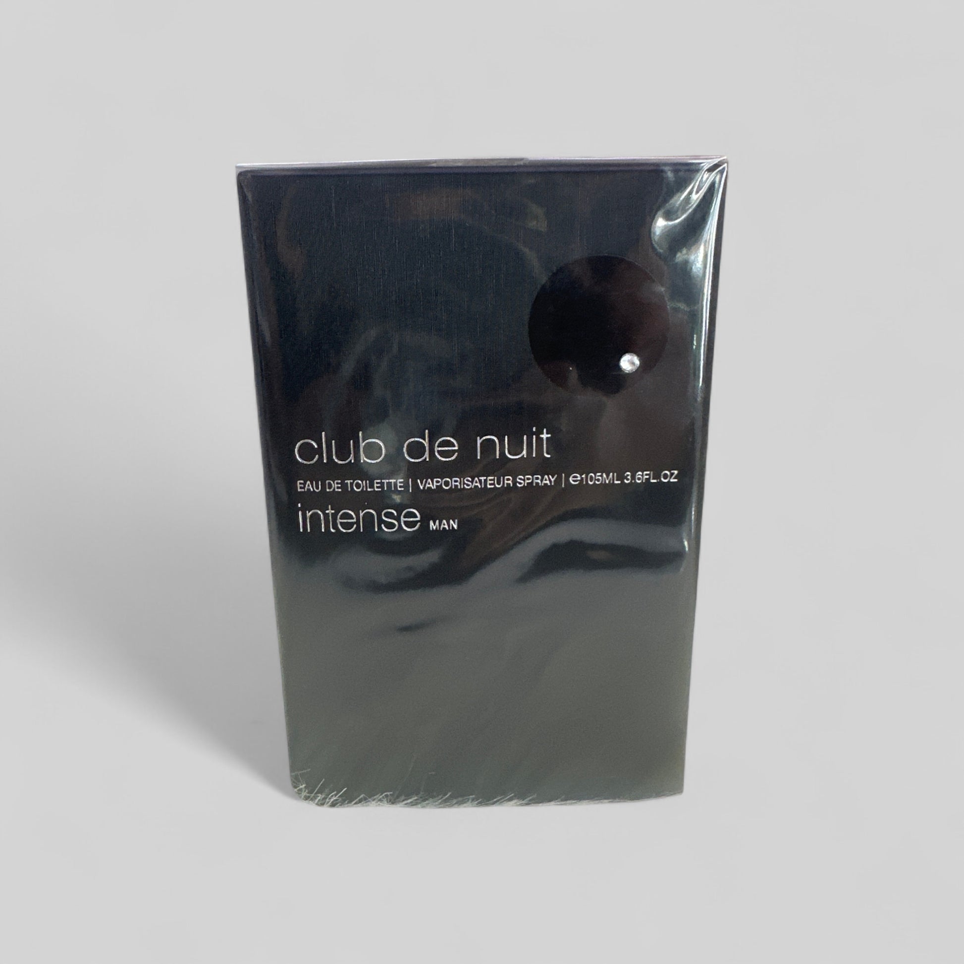 Packaged perfume bottle of 'club de nuit intense' on a light gray background